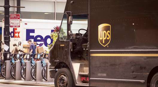 UPS and FedEx trucks