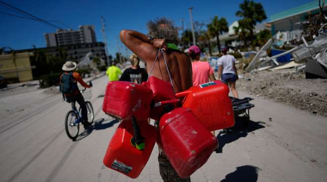Man carrying gas containers