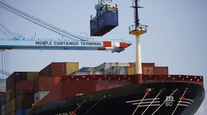 A container is loaded onto the Mediterranean Shipping Co. Pilar cargo ship