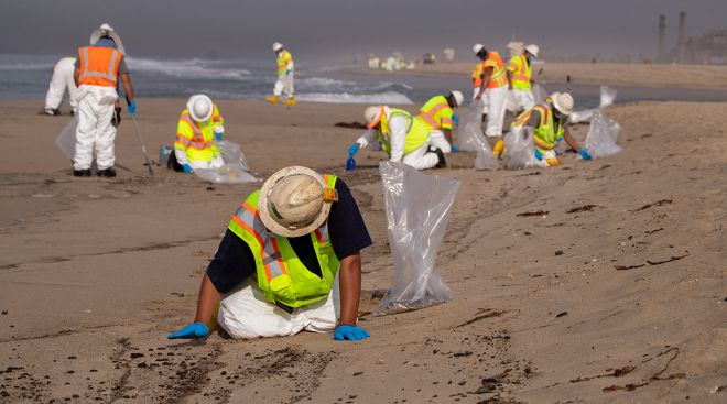 Cleanup crews spread out across Huntington State Beach