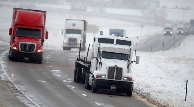 Truckers head westbound on Interstate 70 bound for Denver