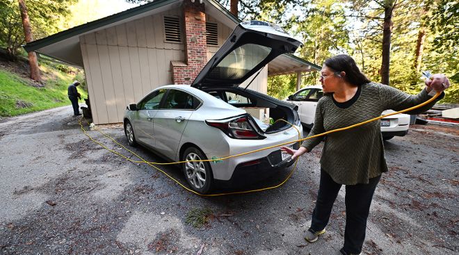 Tammy Snyder sets up her Chevy Bolt to power her home