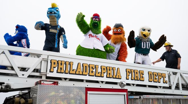 Philadelphia sports mascots ride a fire truck to celebrate reopening of I-95