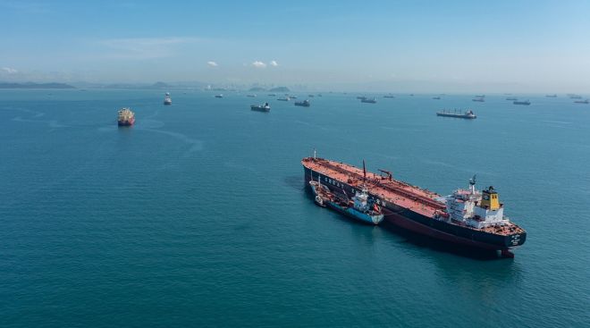 Cargo ships wait to cross the Panama Canal