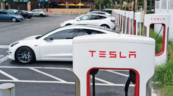 Tesla's EVs at a charging station