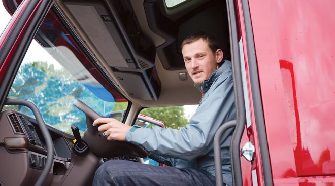 Getty Image of a truck driver in his cab