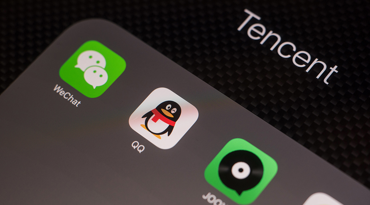 The icons for Tencent Holdings Ltd. applications including WeChat, from left, QQ, JOOX and Tencent News are arranged for a photograph on an Apple Inc. iPad. 