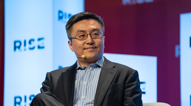 Xpeng Inc. Vice Chairman Brian Gu said Tesla's progress is helping to accelerate EV market growth in China.