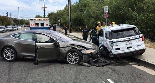 A Tesla sedan that crashed into a police cruiser in Laguna Beach, Calif.