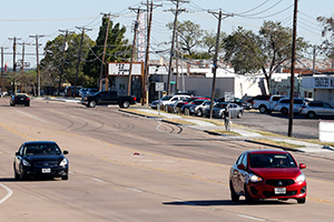 Motorists drive along Mansfield Highway in Forest Hill, Texas